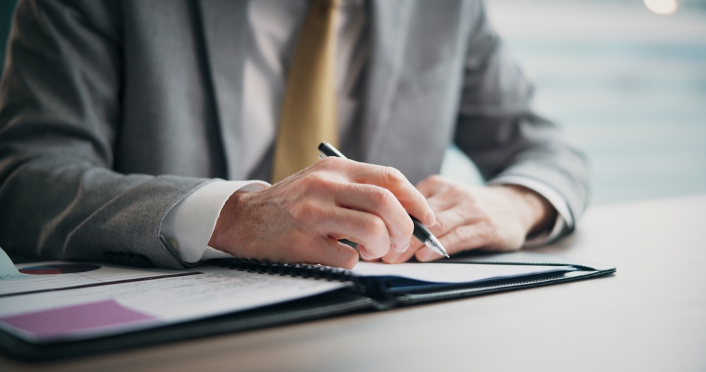 Business,Person,,Hands,And,Writing,With,Documents,For,Corporate,Finance,